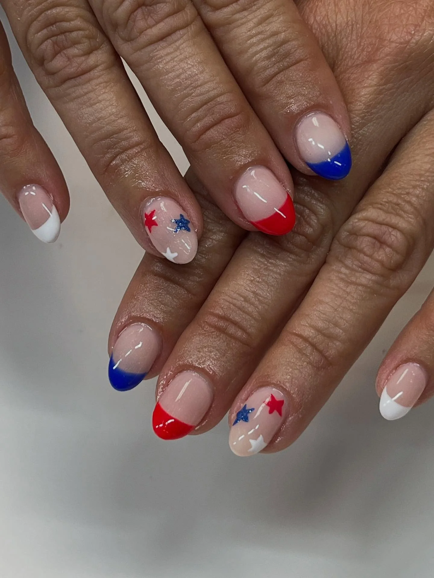 patriotic nails 2026 Minimal Red White And Blue French Tips With Tiny Star Details