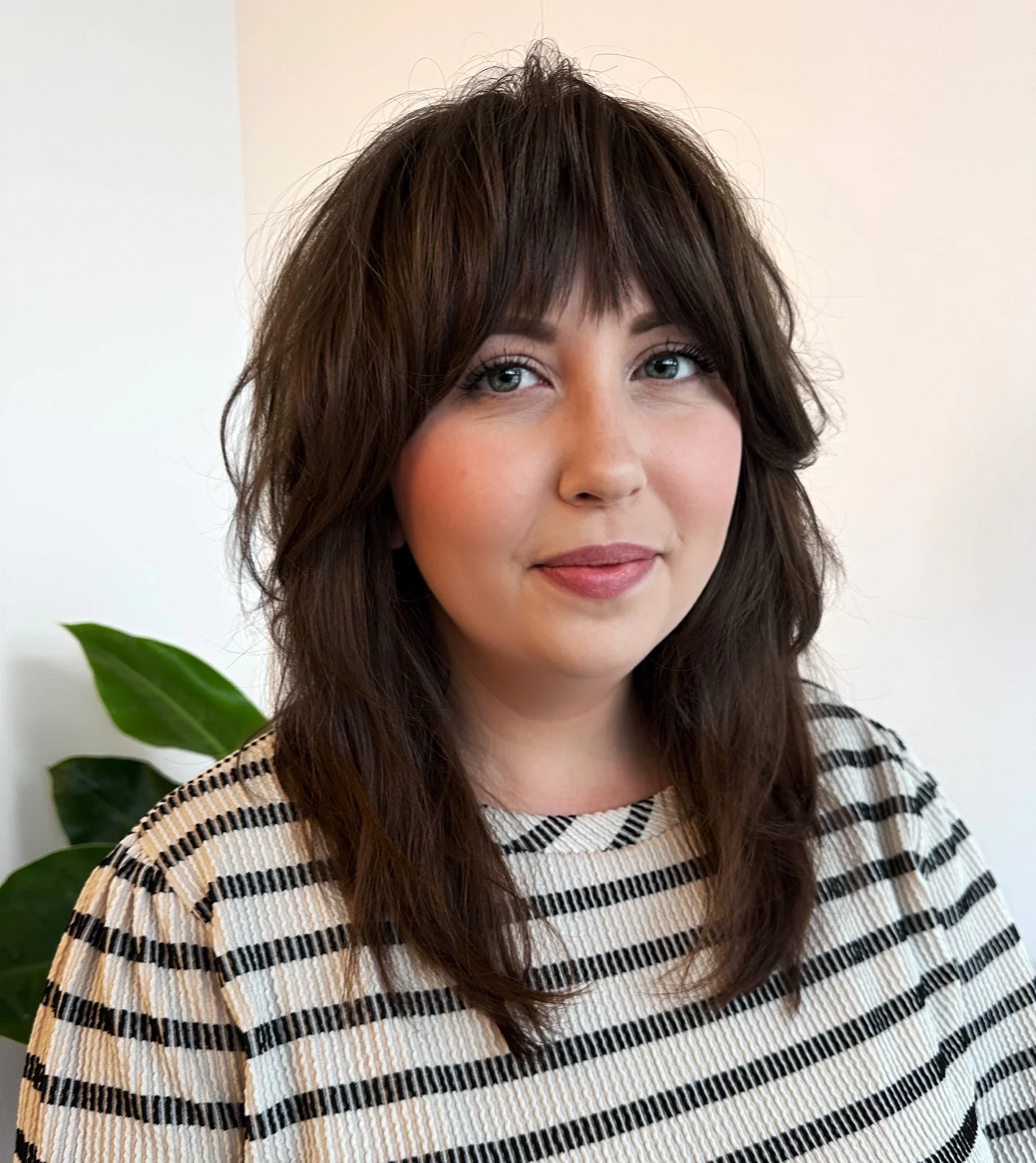sophisticated summer haircuts for women over 40 2026 Soft Layered Medium Cut With Full Fringe
