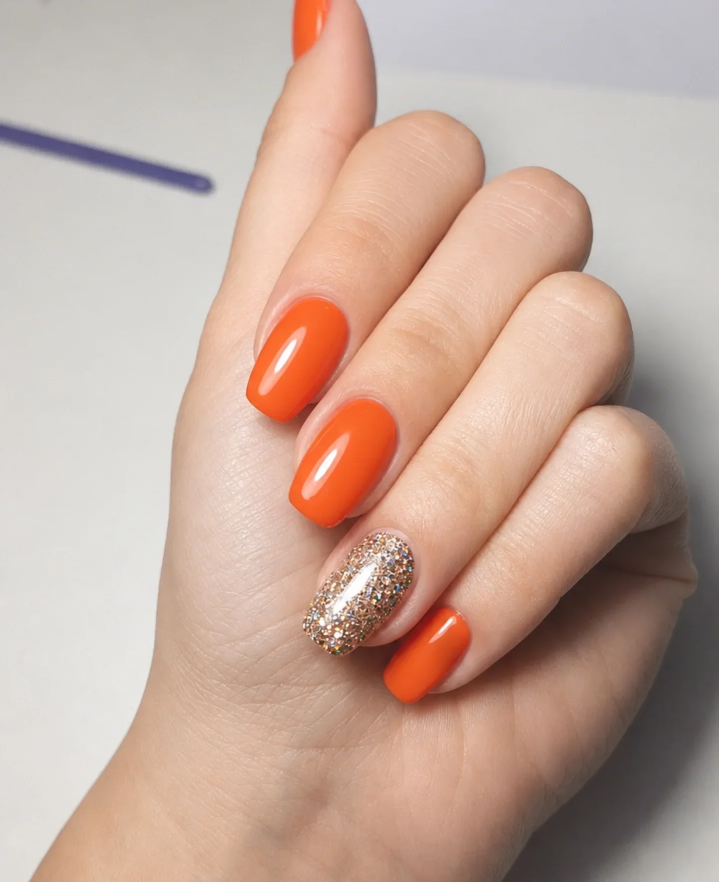 summer glitter nails 2026 Neon Orange Glow With Golden Glitter Accent