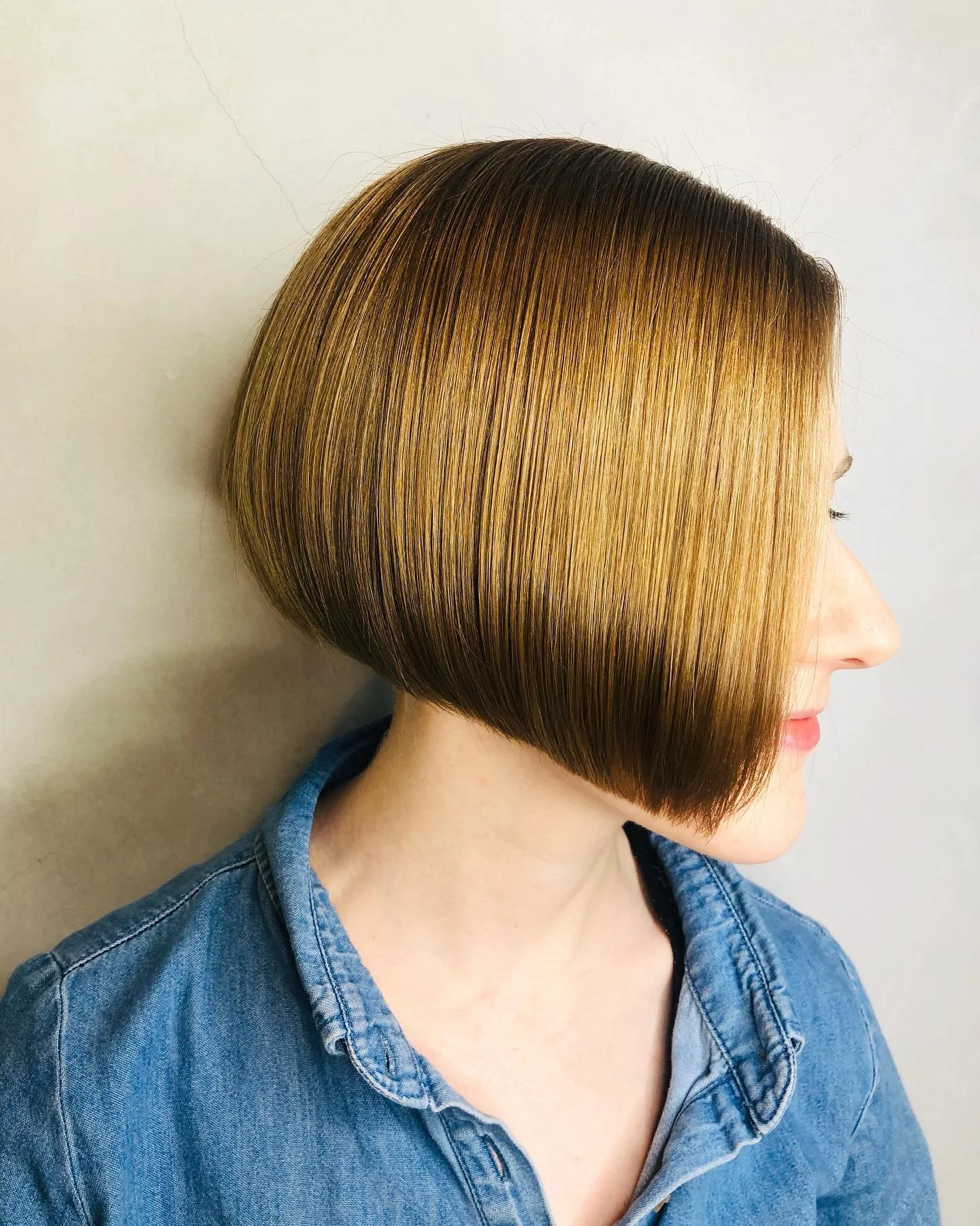 summer short haircuts 2026 Glass Finish Angled Bob With Sharp Lines