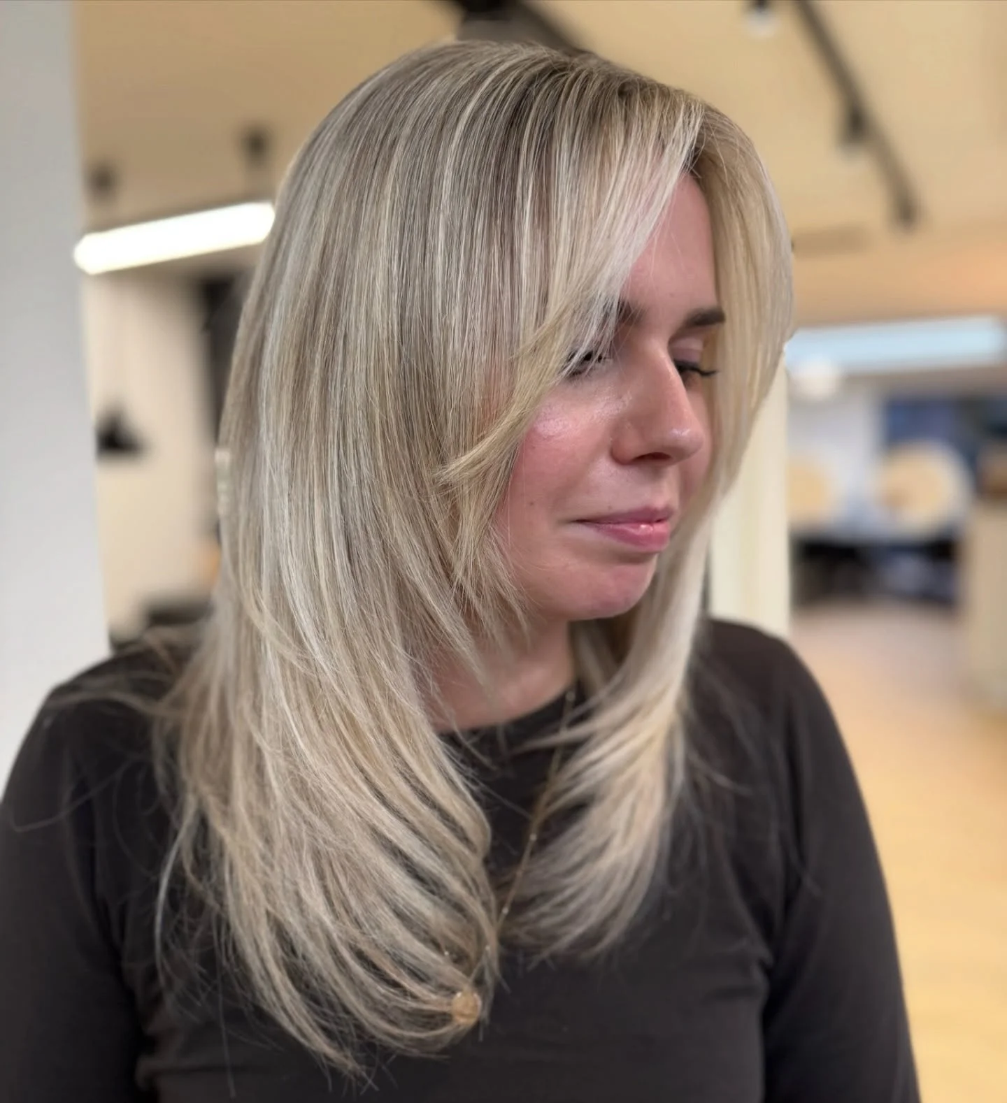 sophisticated summer haircuts for women over 40 2026 Long Feathered Layers With Curtain Movement