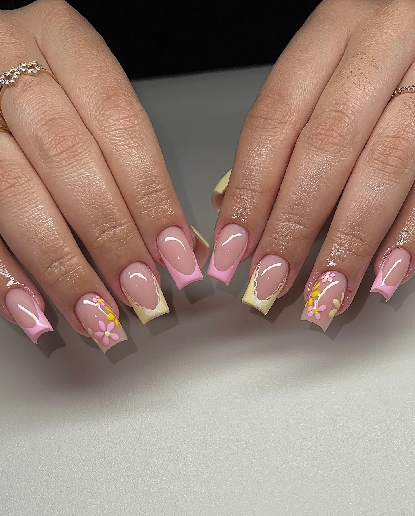 summer acrylic nails 2026 Pastel Pink French Tips With Sweet Daisy Accents