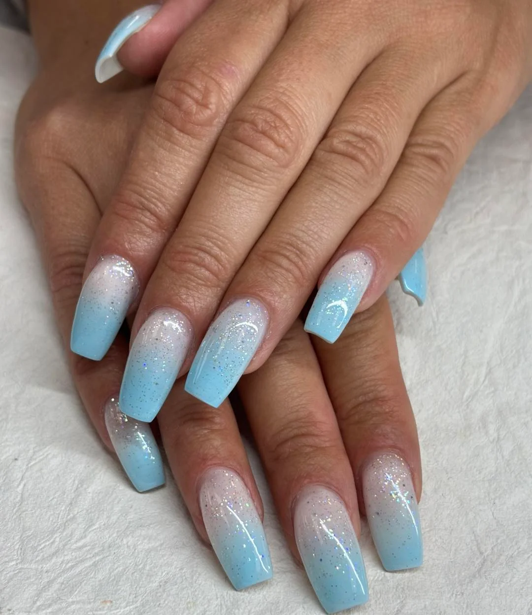 summer ombre nails 2026 Ice Blue Glitter Ombre For Cool-Toned Summer Glam