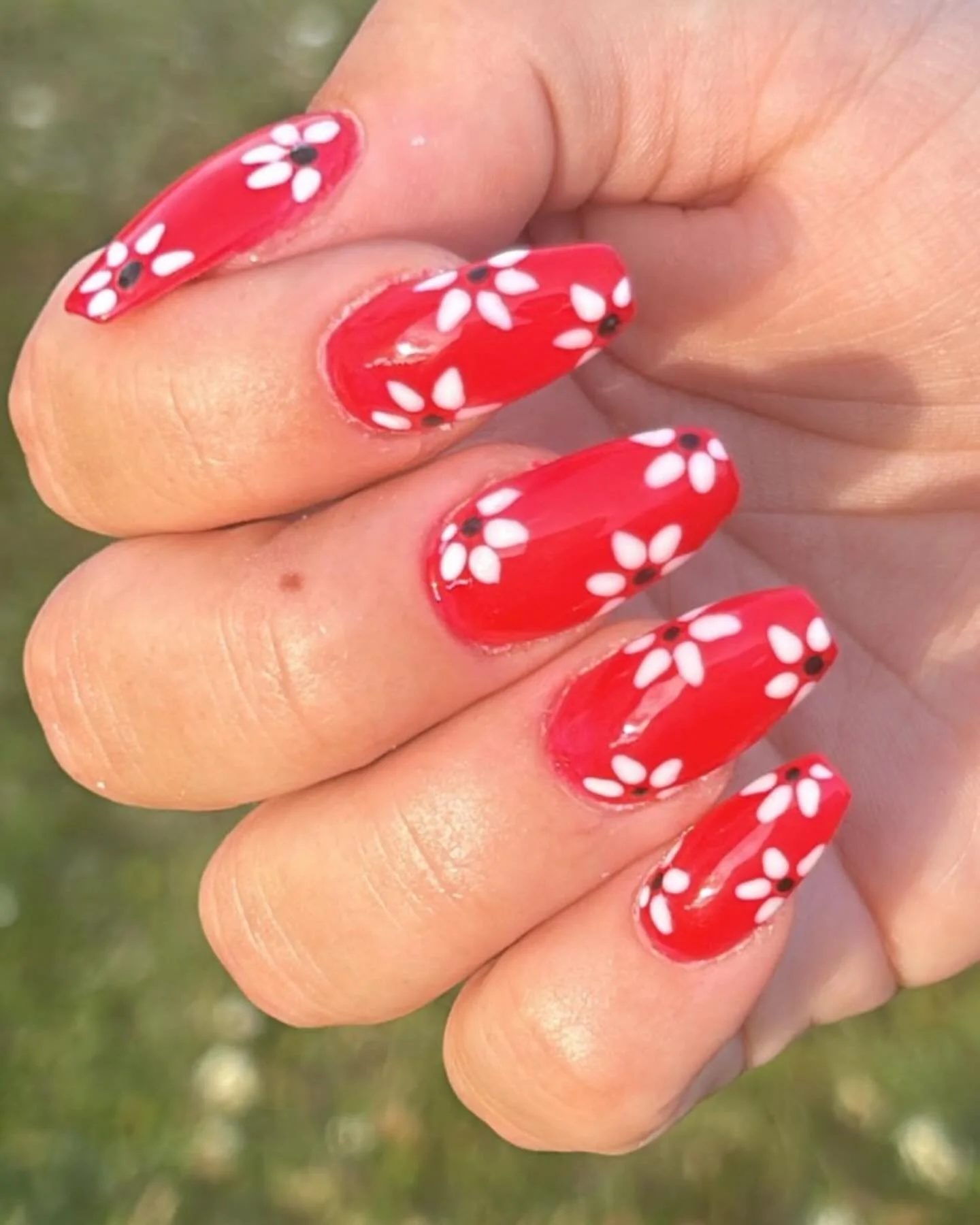 summer vibrant nails 2026 Cherry Red Daisy Nails That Never Go Out Of Style