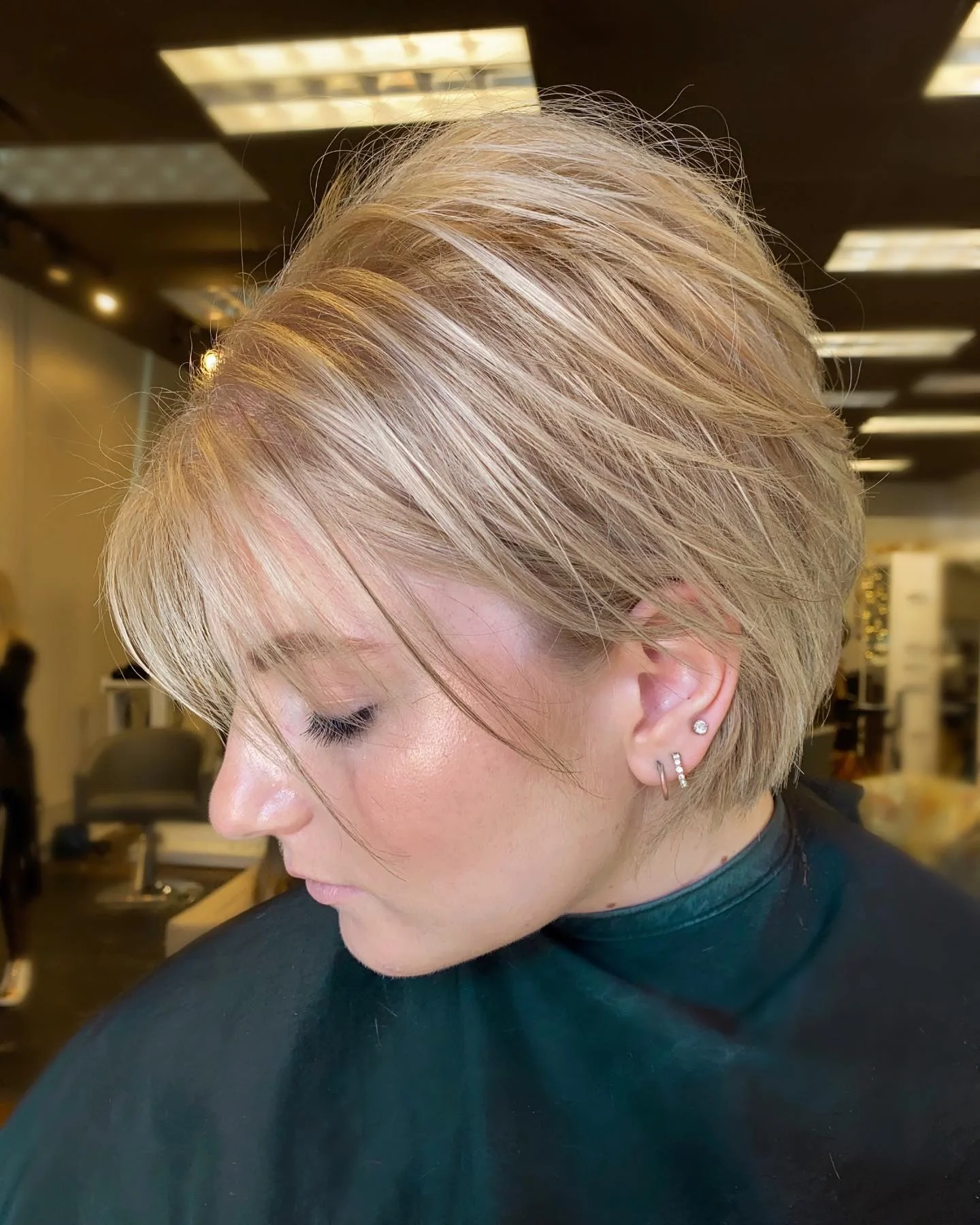 sleek summer short haircuts 2026 Ultra Smooth Platinum Pixie With Sculpted Edges