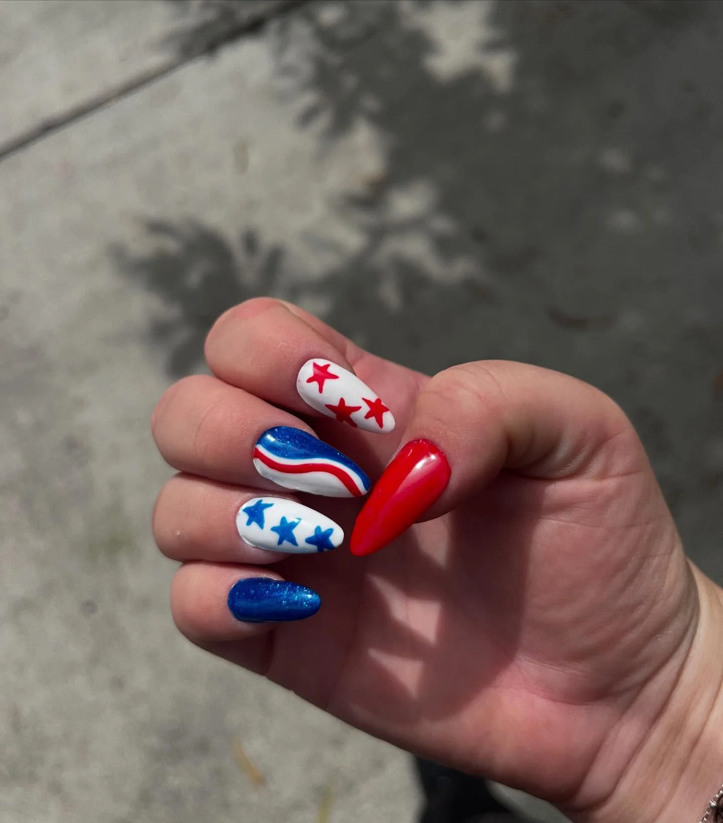 usa nails 2026 Bold Star-Spangled Almond Nails With Glossy Summer Energy