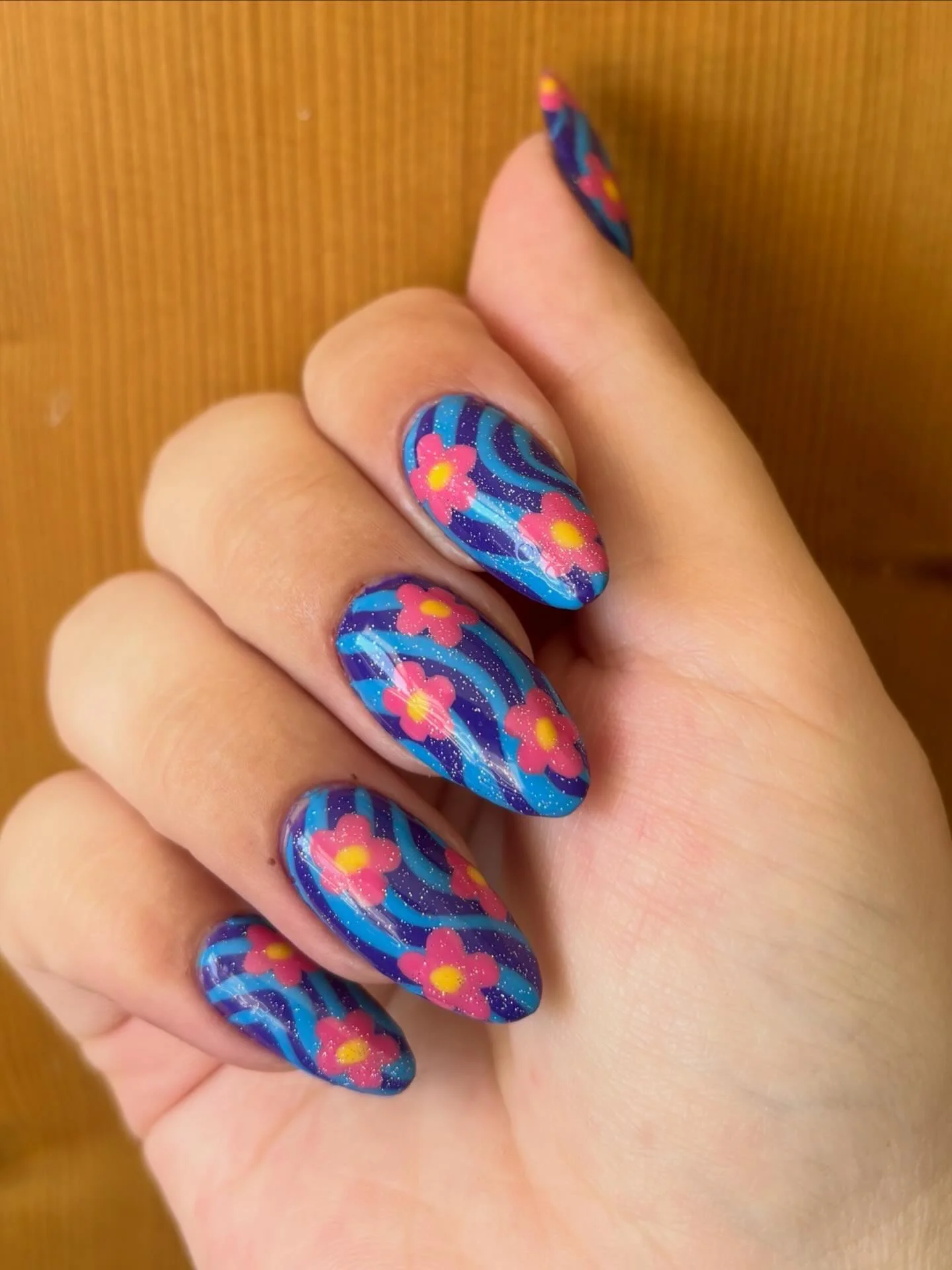 June Nails Ideas 2026 - Summer Trends 2026 Retro Blue Swirl Nails With Playful Flower Power Energy