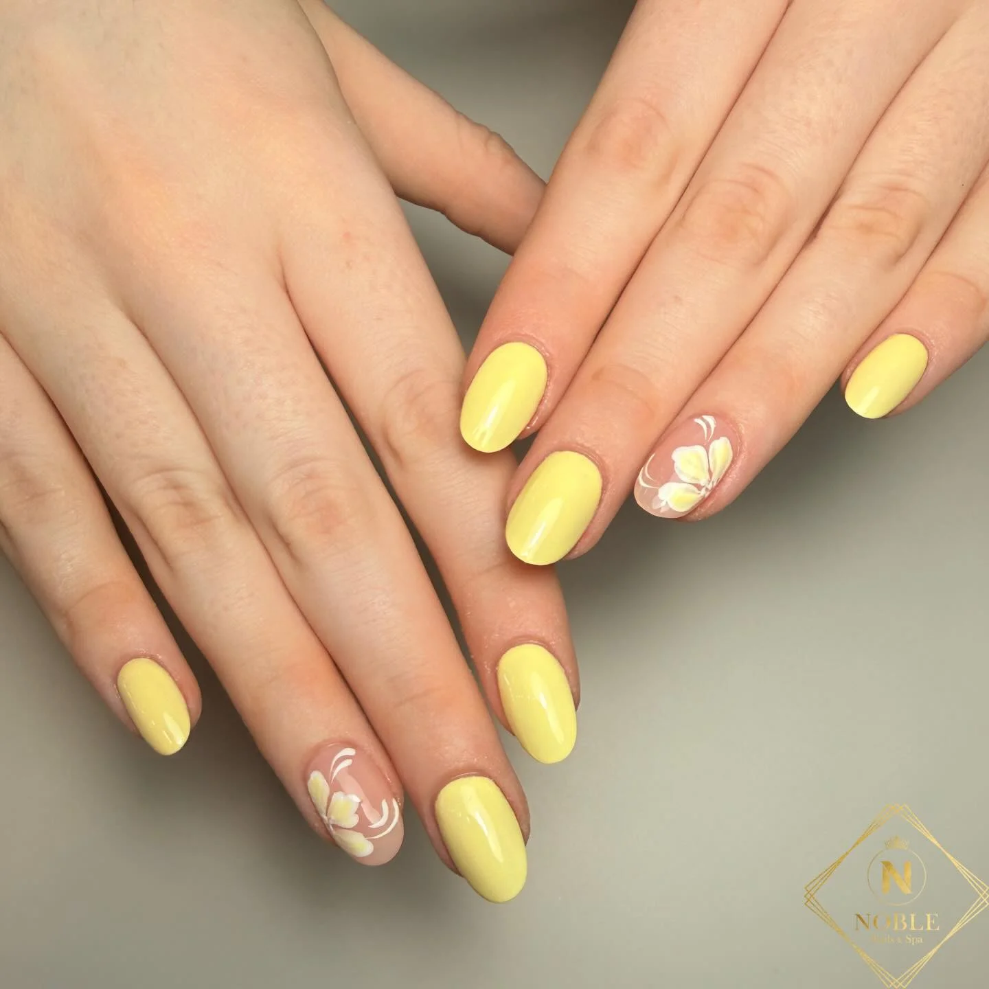 summer yellow nails 2026 Soft Butter Yellow Floral Nails For A Clean Summer Look