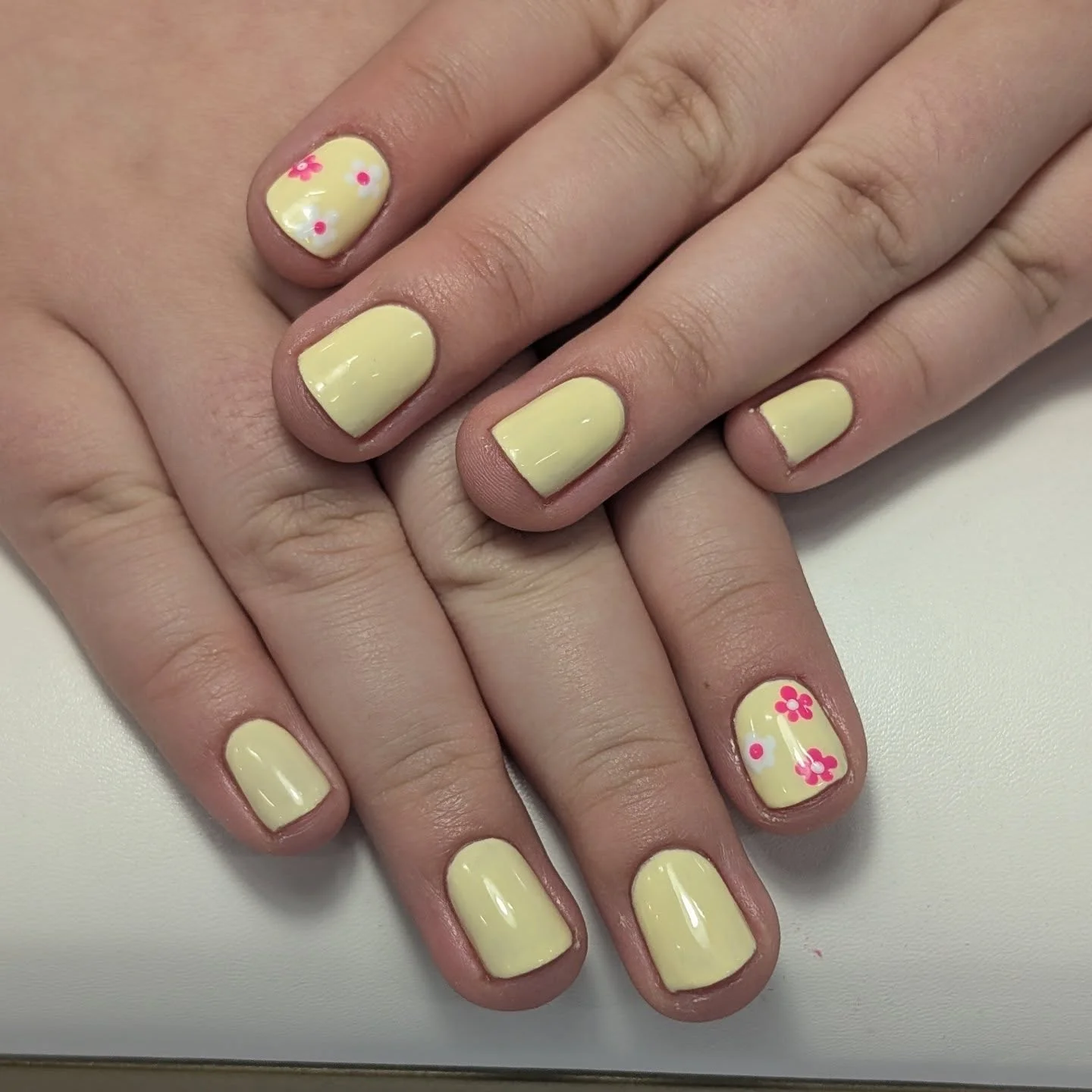 trendy summer nails 2026 Butter Yellow Minimalist Nails With Tiny Floral Accents
