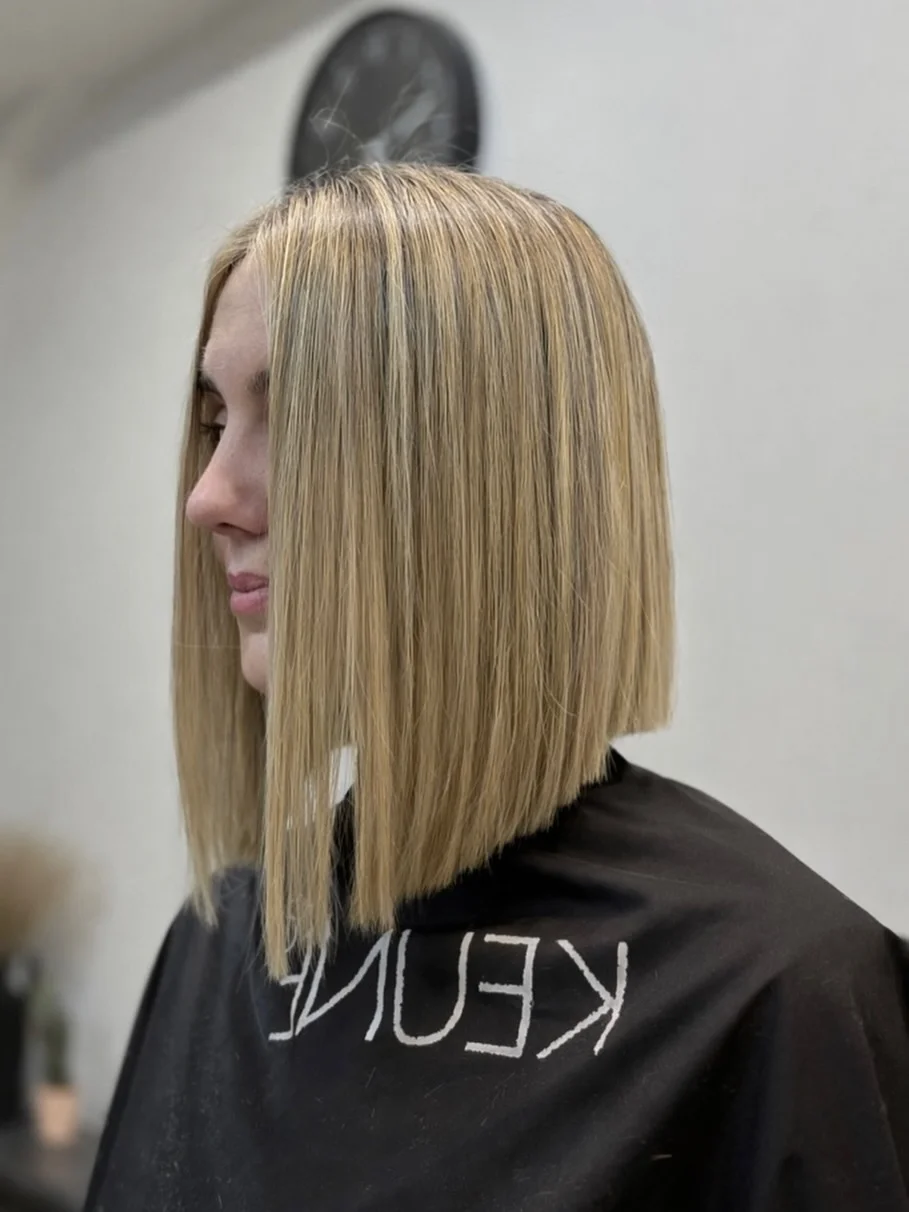 angled summer bob haircut 2026 Blunt Blonde Angle With Sharp Minimal Finish