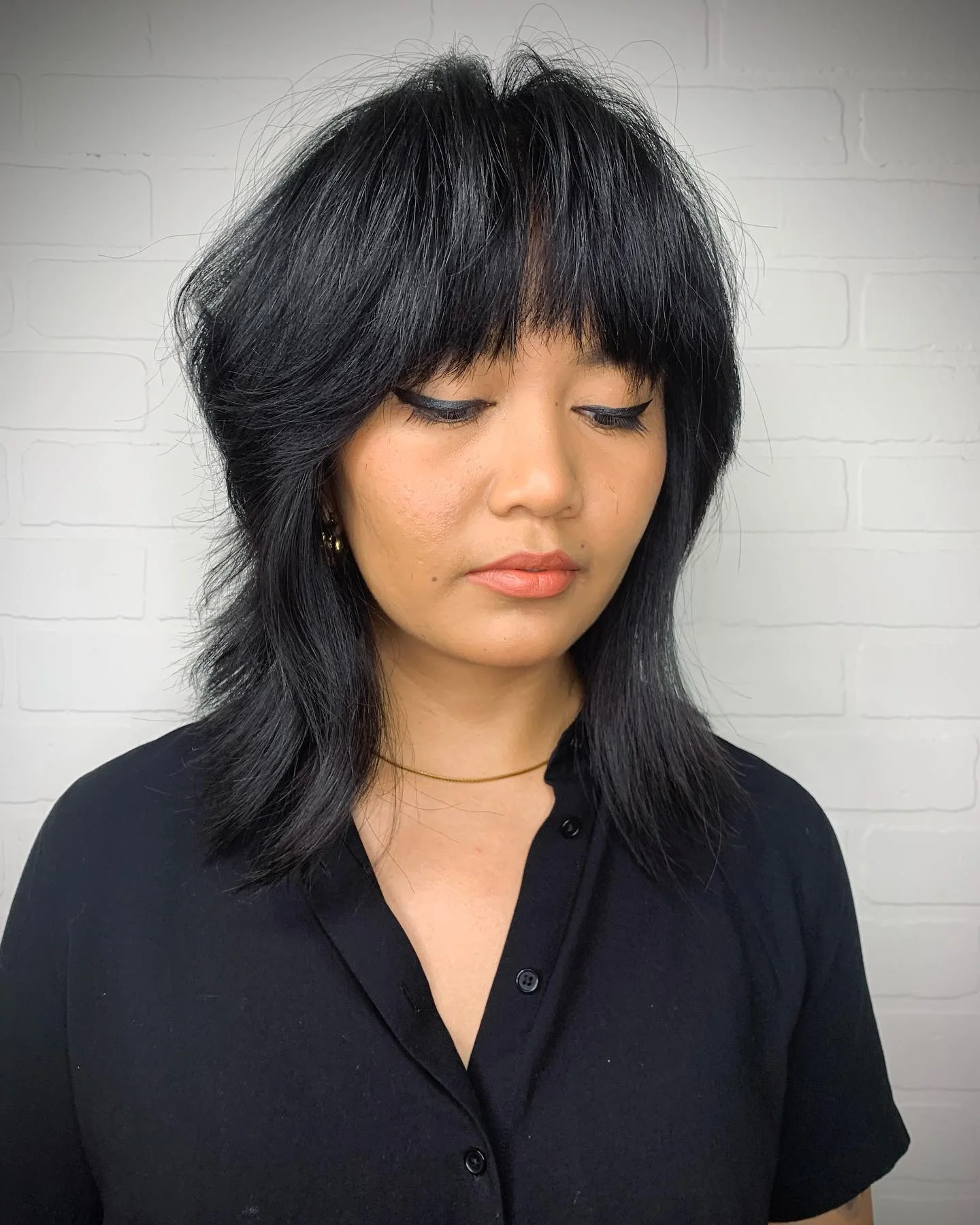 cool summer shag haircut 2026 Choppy Black Shag With Full Fringe Energy