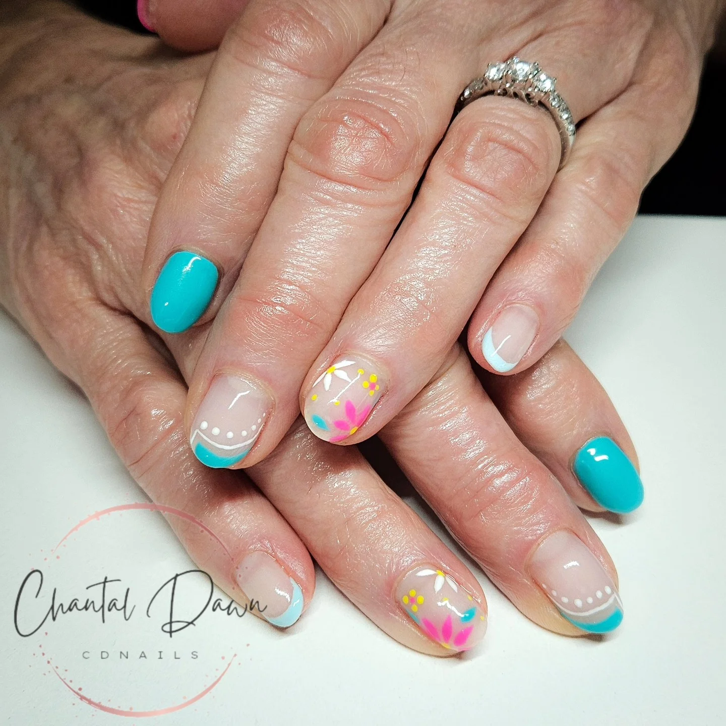 short gel nails summer 2026 Turquoise French Tips With Playful Retro Florals