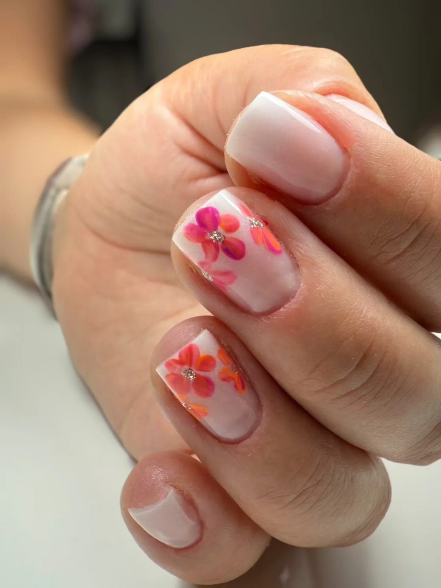 short summer nails 2026 Soft Hibiscus Floral Nails With Milky Base