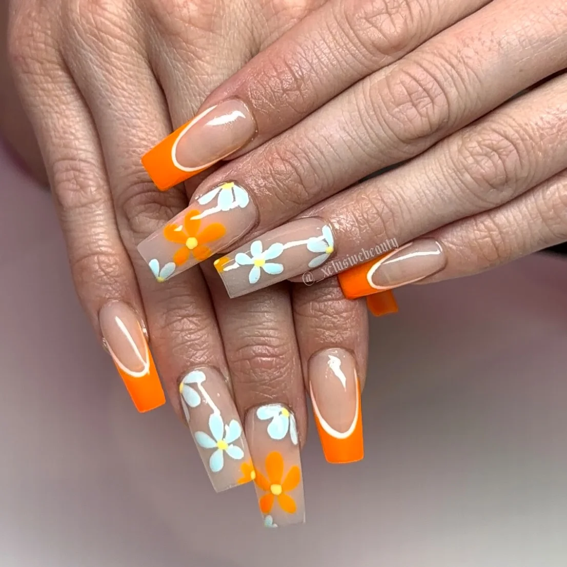 summer acrylic nails 2026 Retro Orange French Tips With Playful Daisy Art
