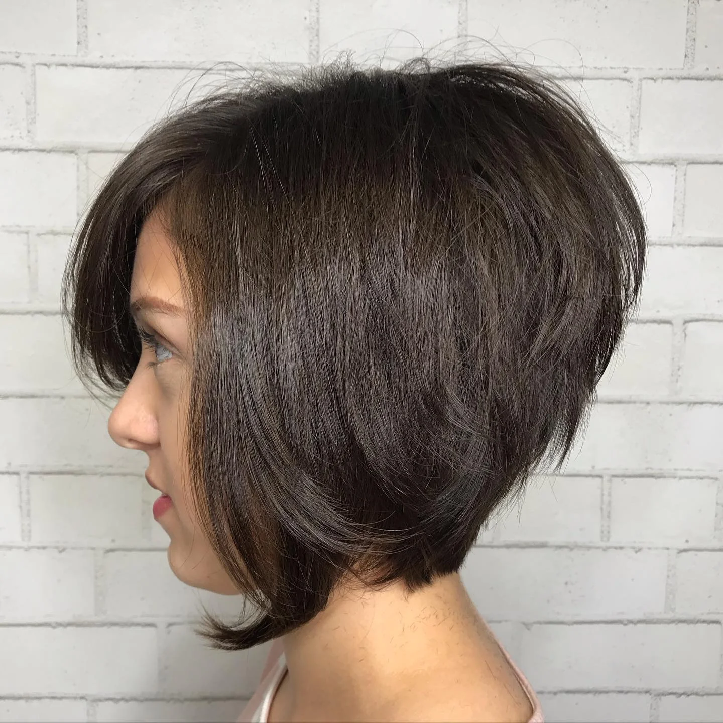 angled summer bob haircut 2026 Voluminous Brunette Angle With Soft Lifted Layers