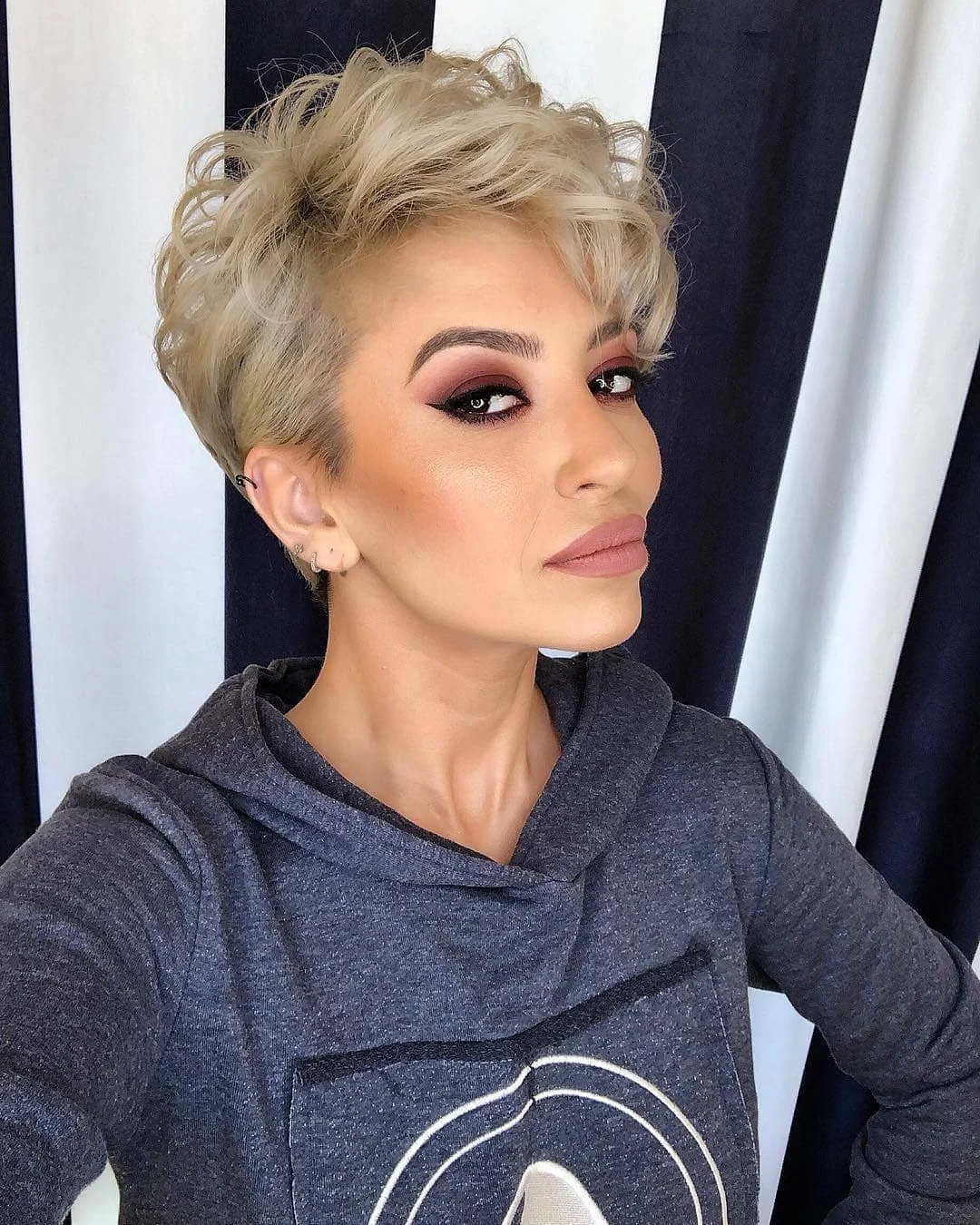 best summer short hairstyles 2026 Edgy Curly Pixie With Undercut Energy