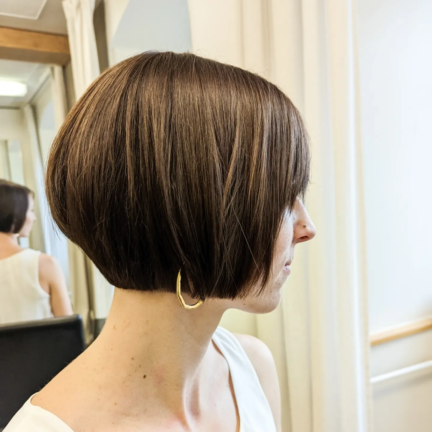 sleek summer short haircuts 2026 Textured Dark Pixie With Feathered Layers