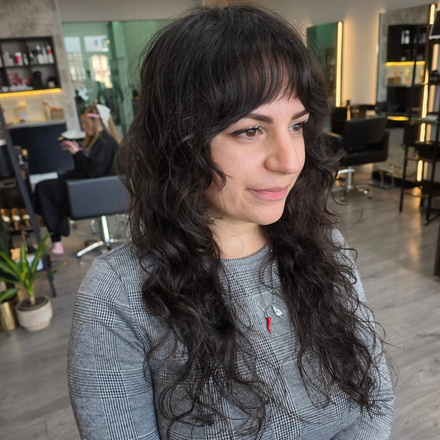 sophisticated summer haircuts for women over 40 2026 Curly Shag With Soft Bangs