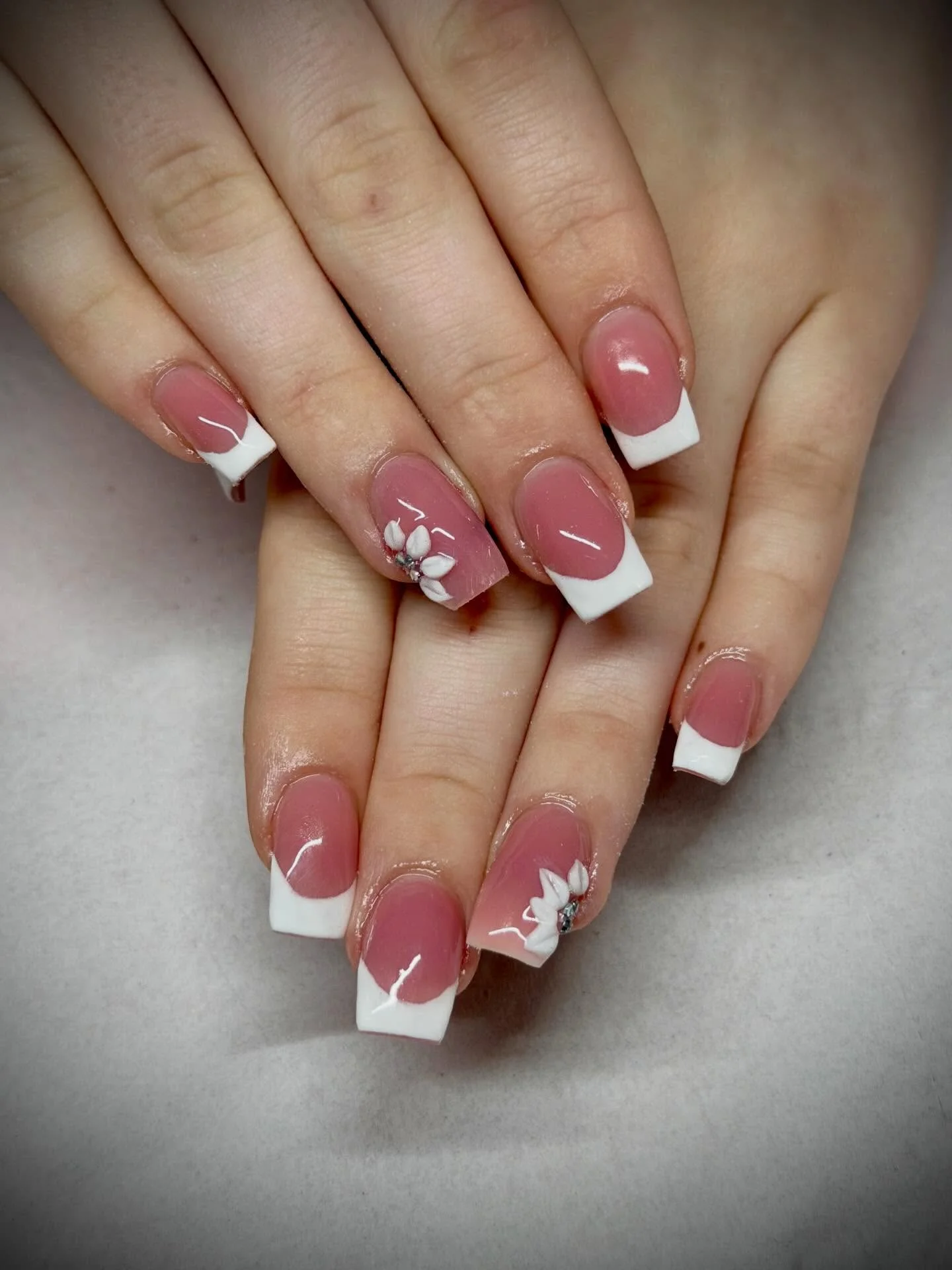 summer acrylic nails 2026 Soft Pink French Tips With Minimal Floral Details