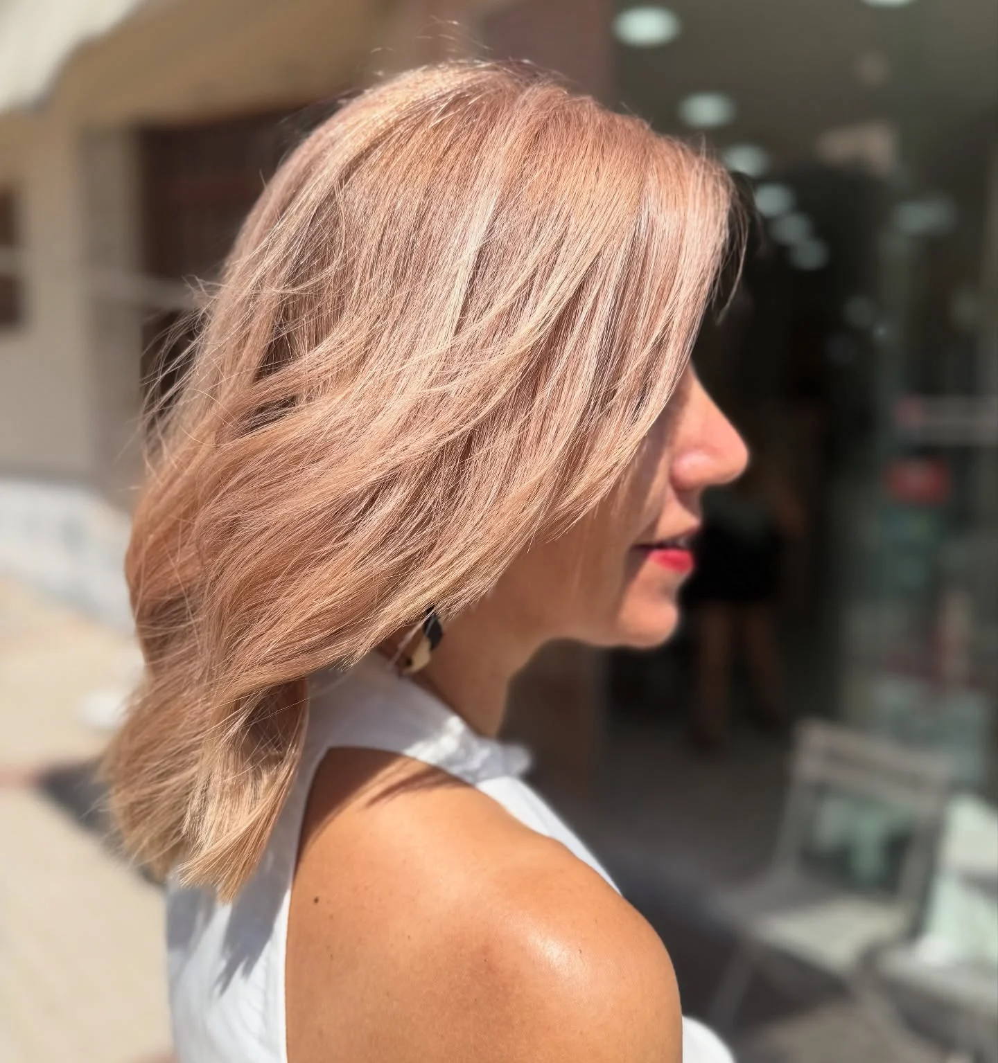 july hair color ideas 2026 Champagne Rose Blonde With Effortless Movement