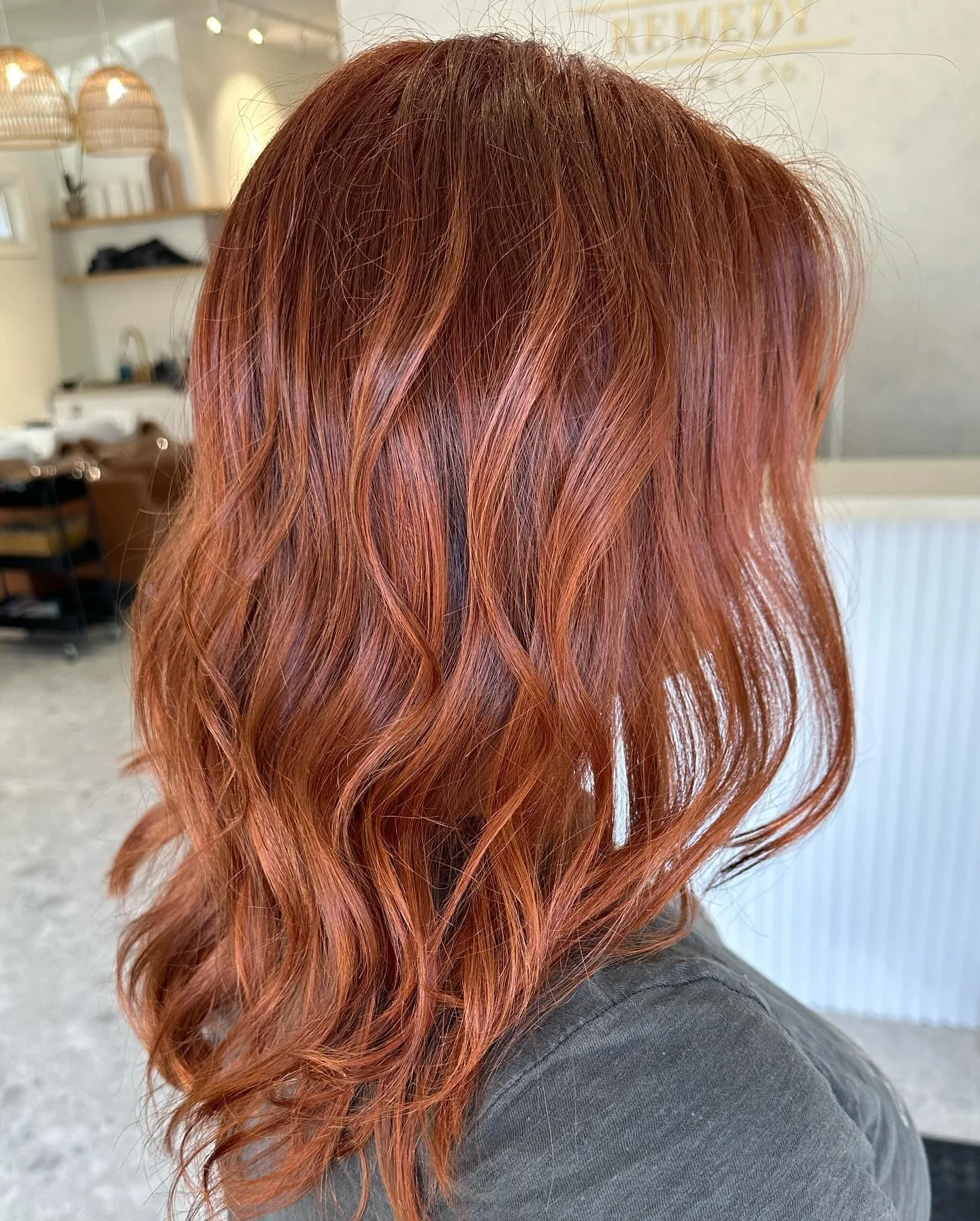 july hair color ideas Spiced Copper Waves With Radiant Summer Dimension