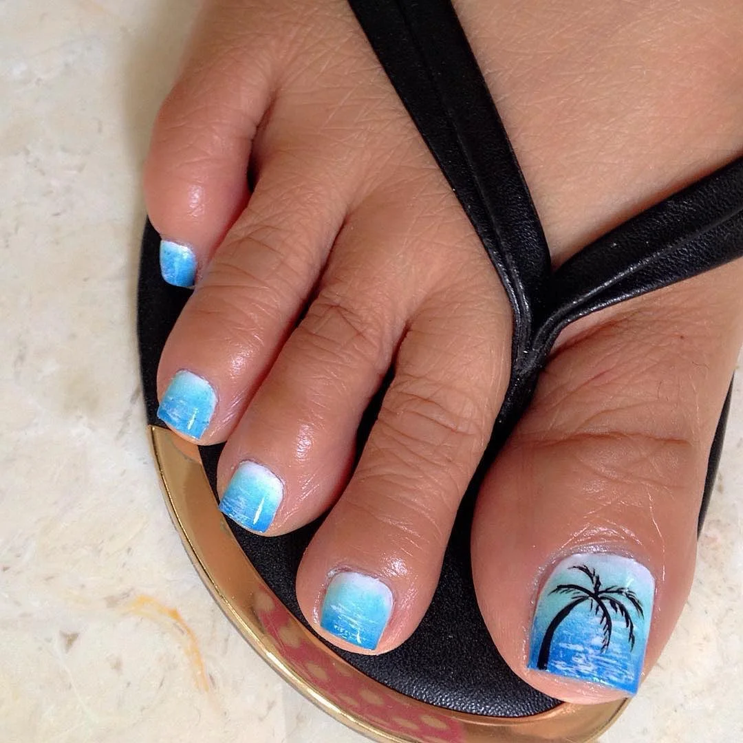 june pedicure ideas 2026 Ocean Blue Gradient With Tropical Palm Silhouette
