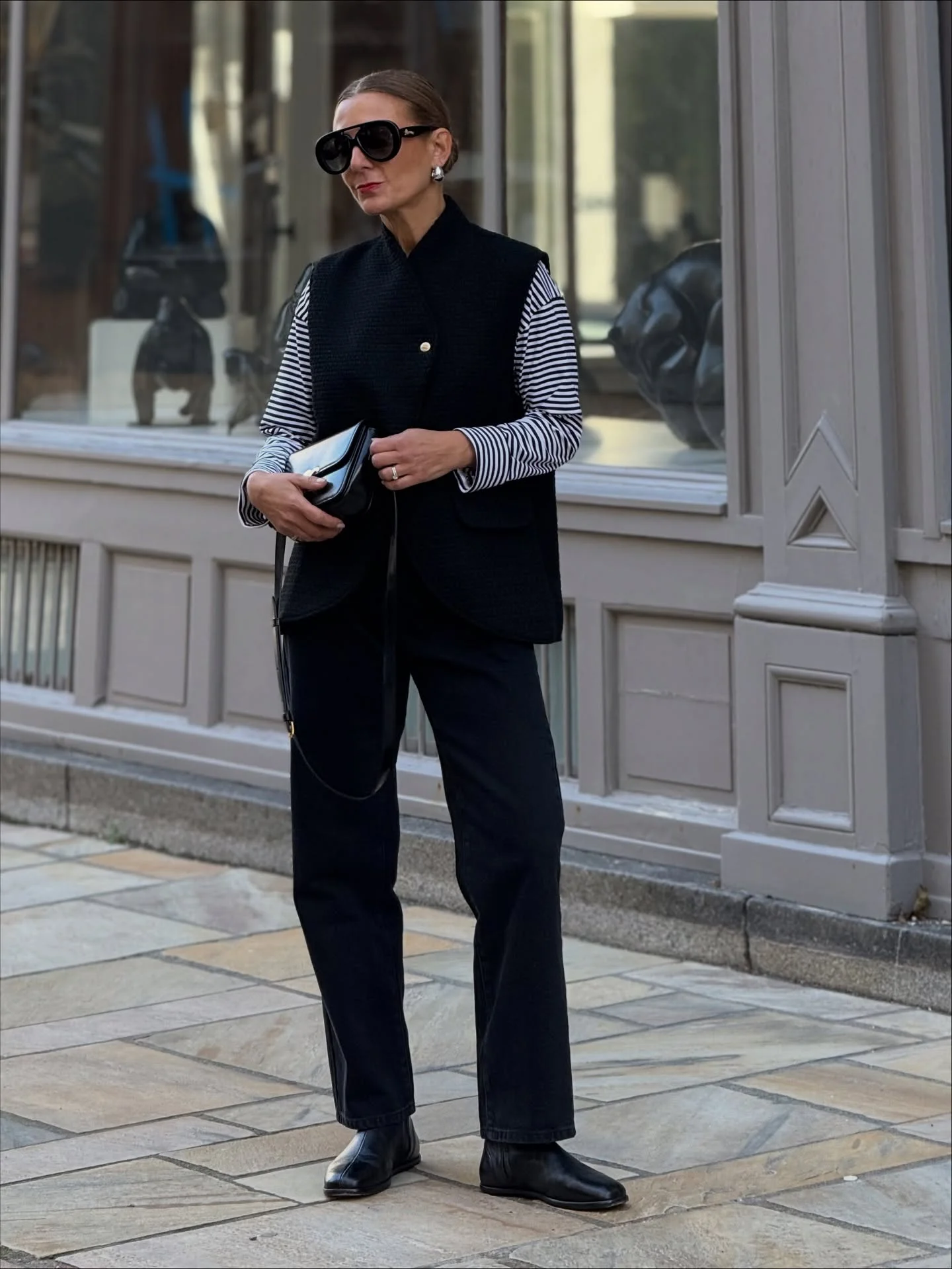 fall outfits with vests 2026 Minimalist Monochrome With A Long Black Vest