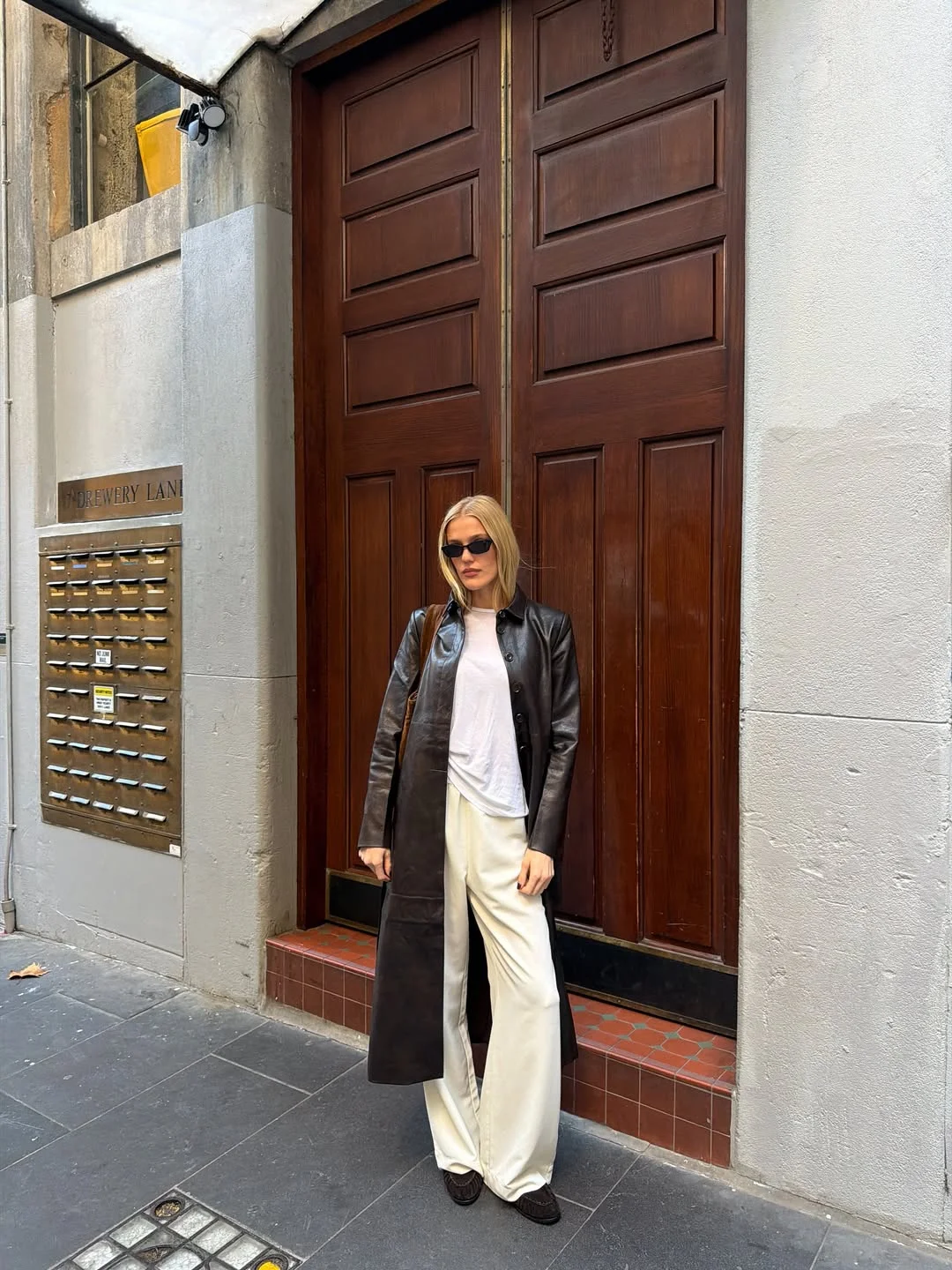 fall pants outfits 2026 Leather Coat And White Wide-Leg Trousers For Elevated Autumn Contrast