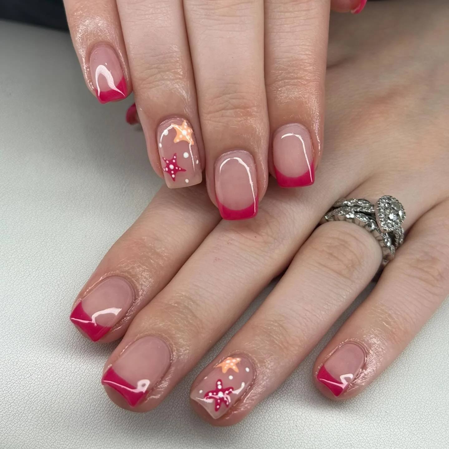 starfish summer nails 2026 Pink French Starfish Charm With Playful Coastal Art