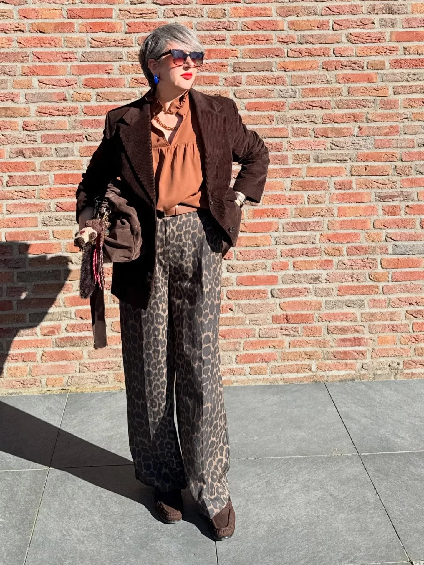 what to wear in fall 2026 over 50 Rich Chocolate Tones And Statement Leopard Trousers
