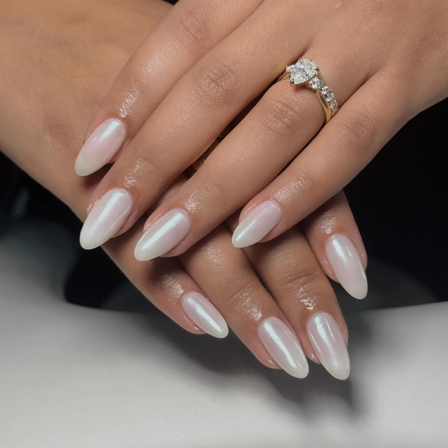 plain summer nails 2026 Pearl White Almond Nails For A Light Reflective Glow