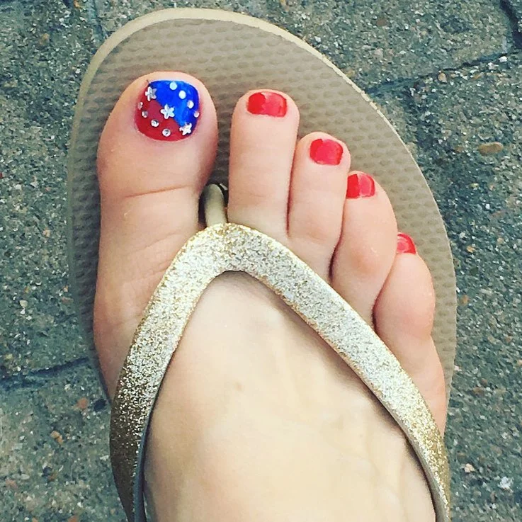 july toe nails design - summer ideas 2026 Red And Blue Sparkle Accent For A Simple Holiday Pedicure