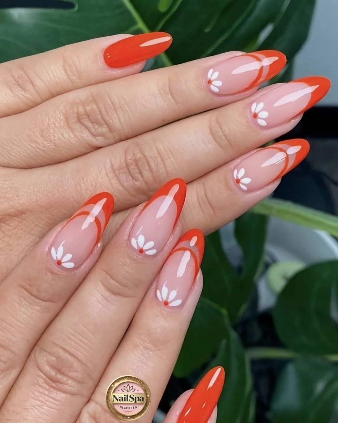 june manicure ideas 2026 Coral Daisy Almond Nails For Sunny Days