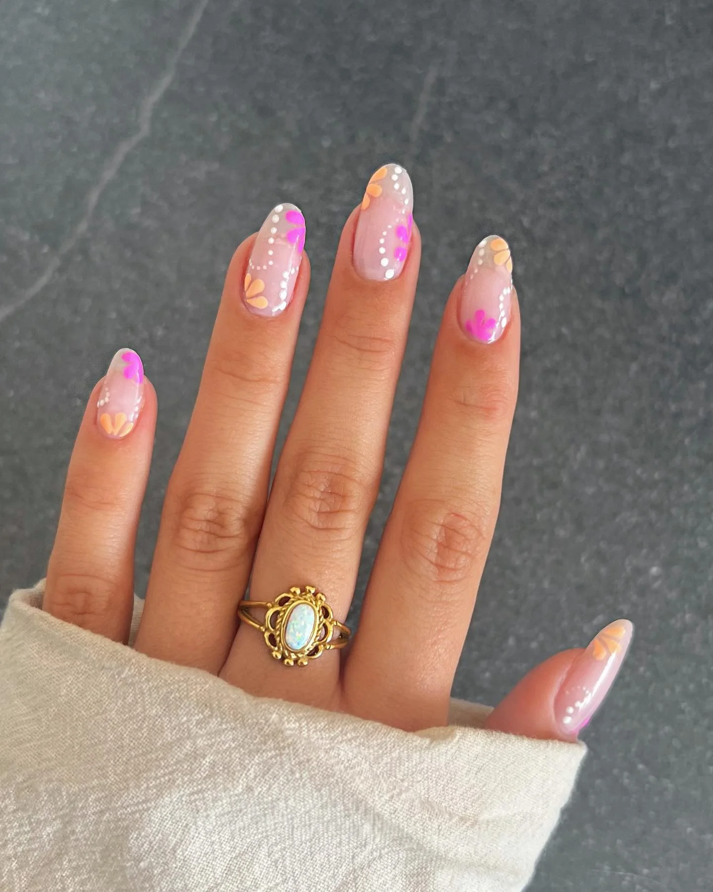 summer oval nails 2026 Whimsical Floral Details With A Modern Sheer Base