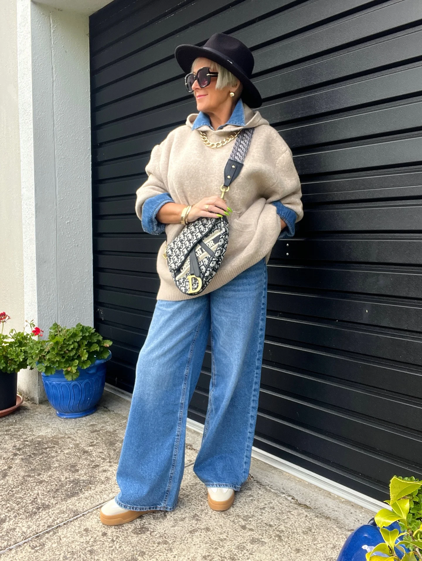 what to wear in fall 2026 over 50 Oversized Knit Layers With Modern Wide-Leg Denim
