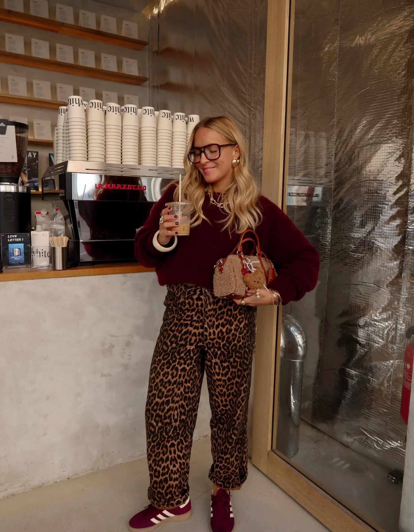 fall outfits with sneakers 2026 Leopard Print Denim And Burgundy Sneakers For A Playful Autumn Statement