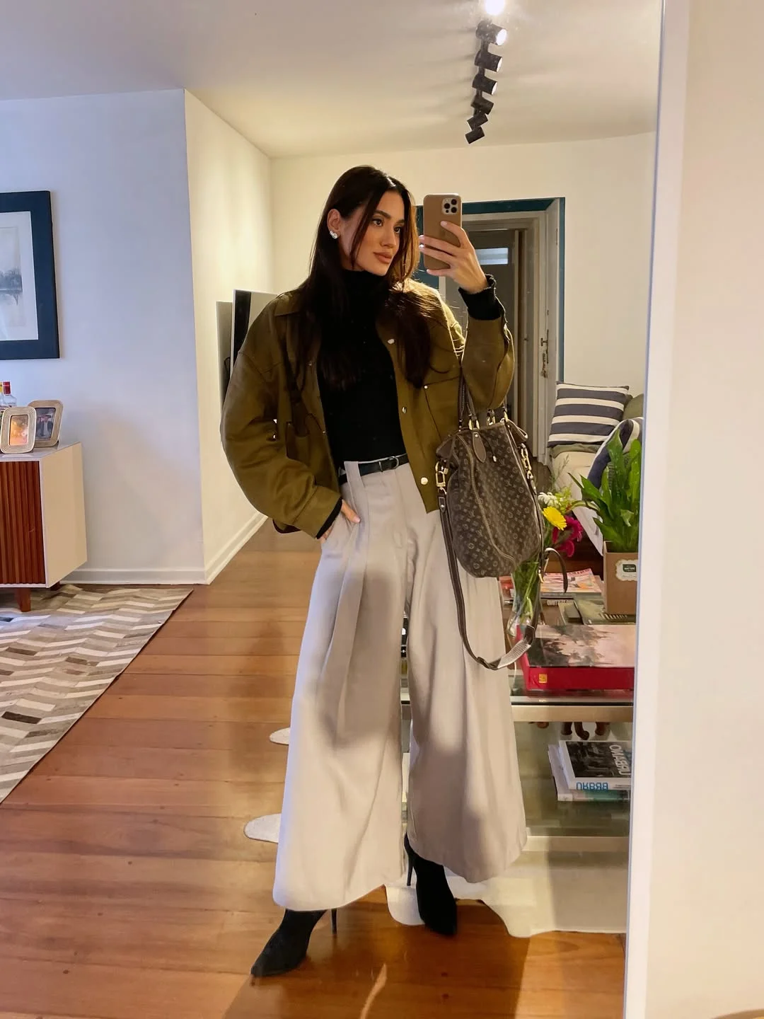 fall pants outfits 2026 Army Green Jacket And White Wide-Leg Trousers For Transitional Weather
